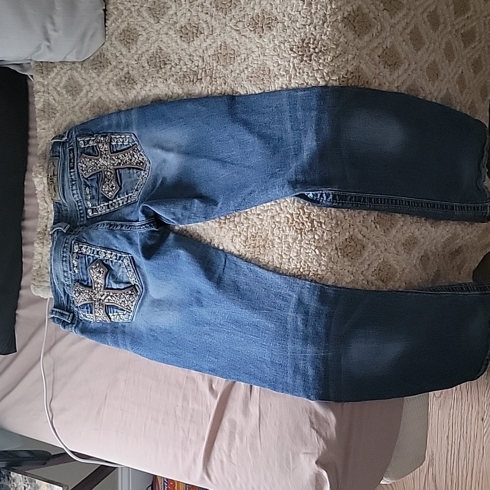 jeans with crosses on the butt pockets